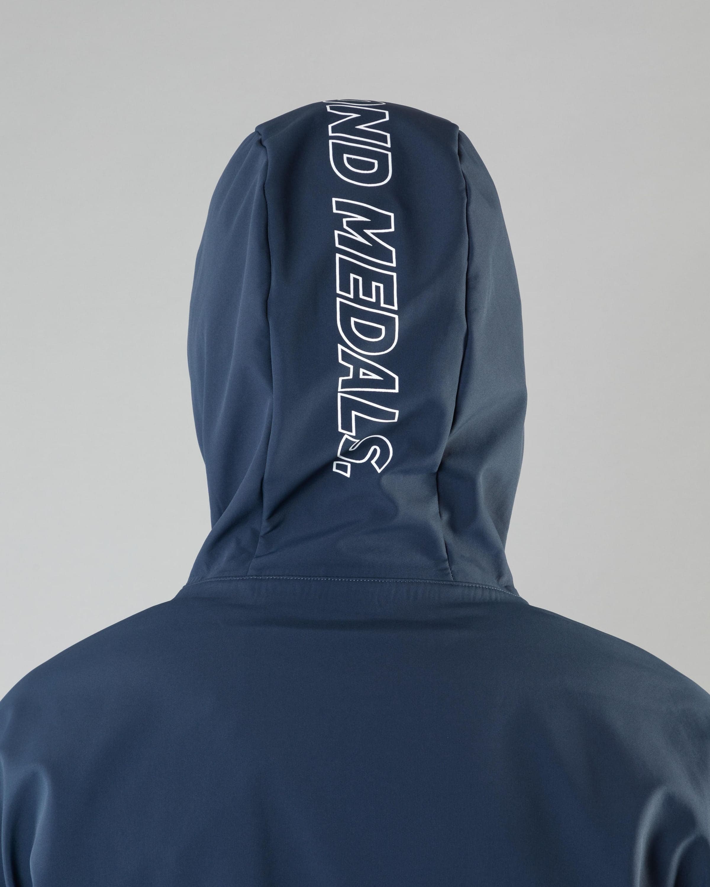 Outerwear clothing, softshell halfzip in blue worn by ULRIK BADERTSCHER, Beyond Medals, 2024, detail2