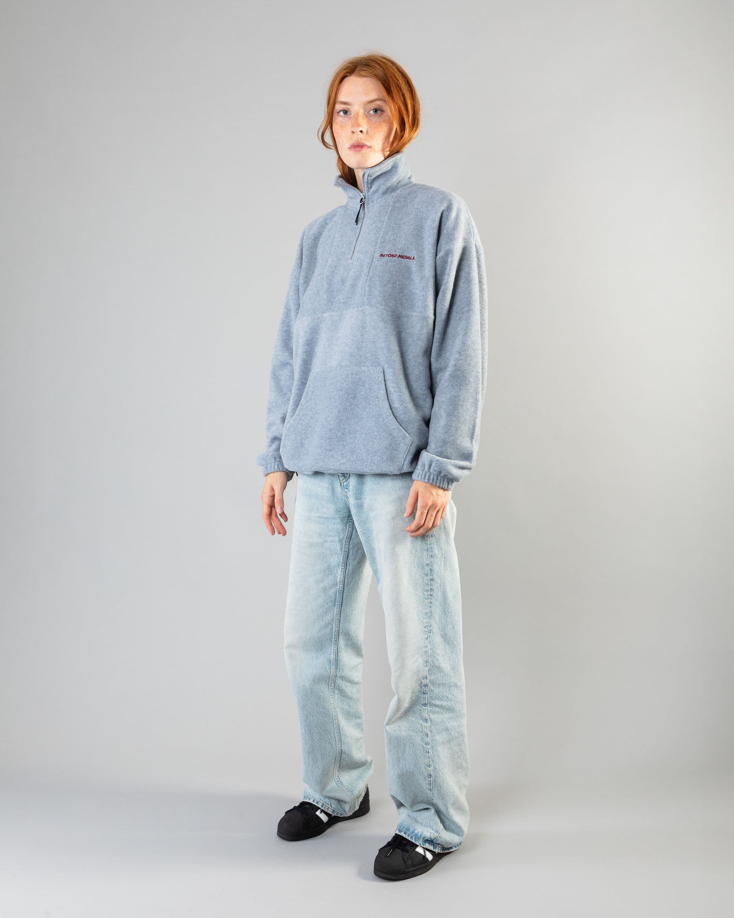 Streetwear clothing, halfzip fleece in grey worn by model, Beyond Medals, 2024, full front1