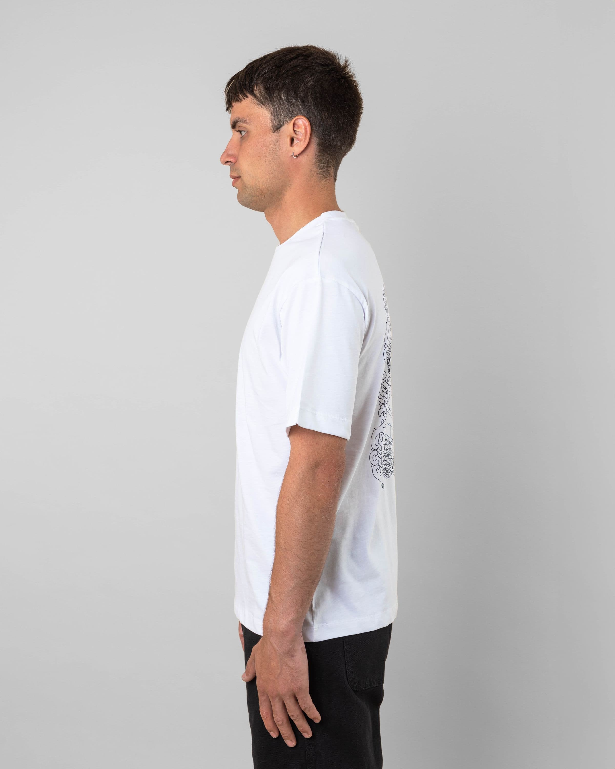 Streetwear clothing, baekkel tee in white worn by model, Beyond Medals, 2024, side2