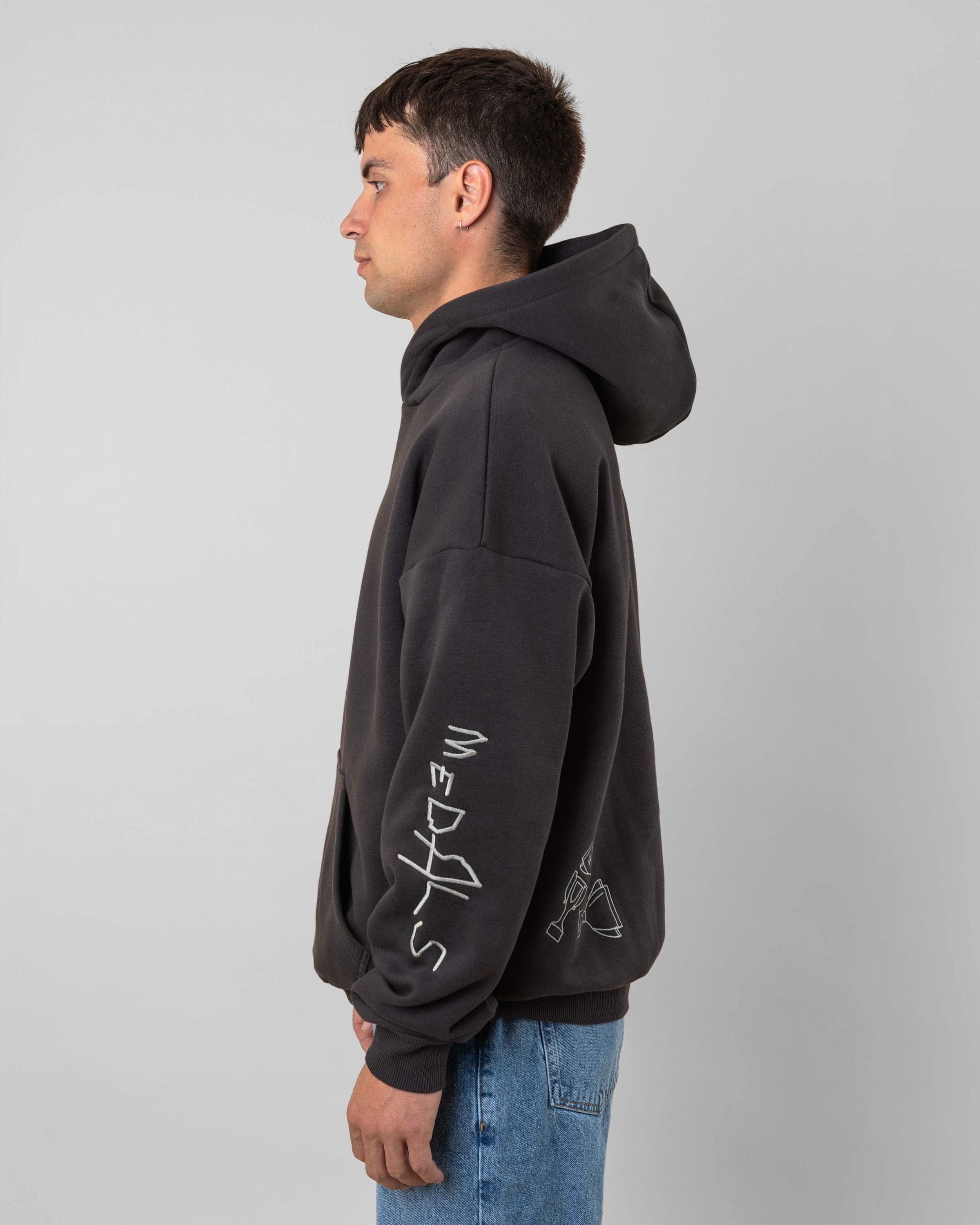 Streetwear clothing, angel hoodie 2.0 in grey worn by model, Beyond Medals, 2024, side3