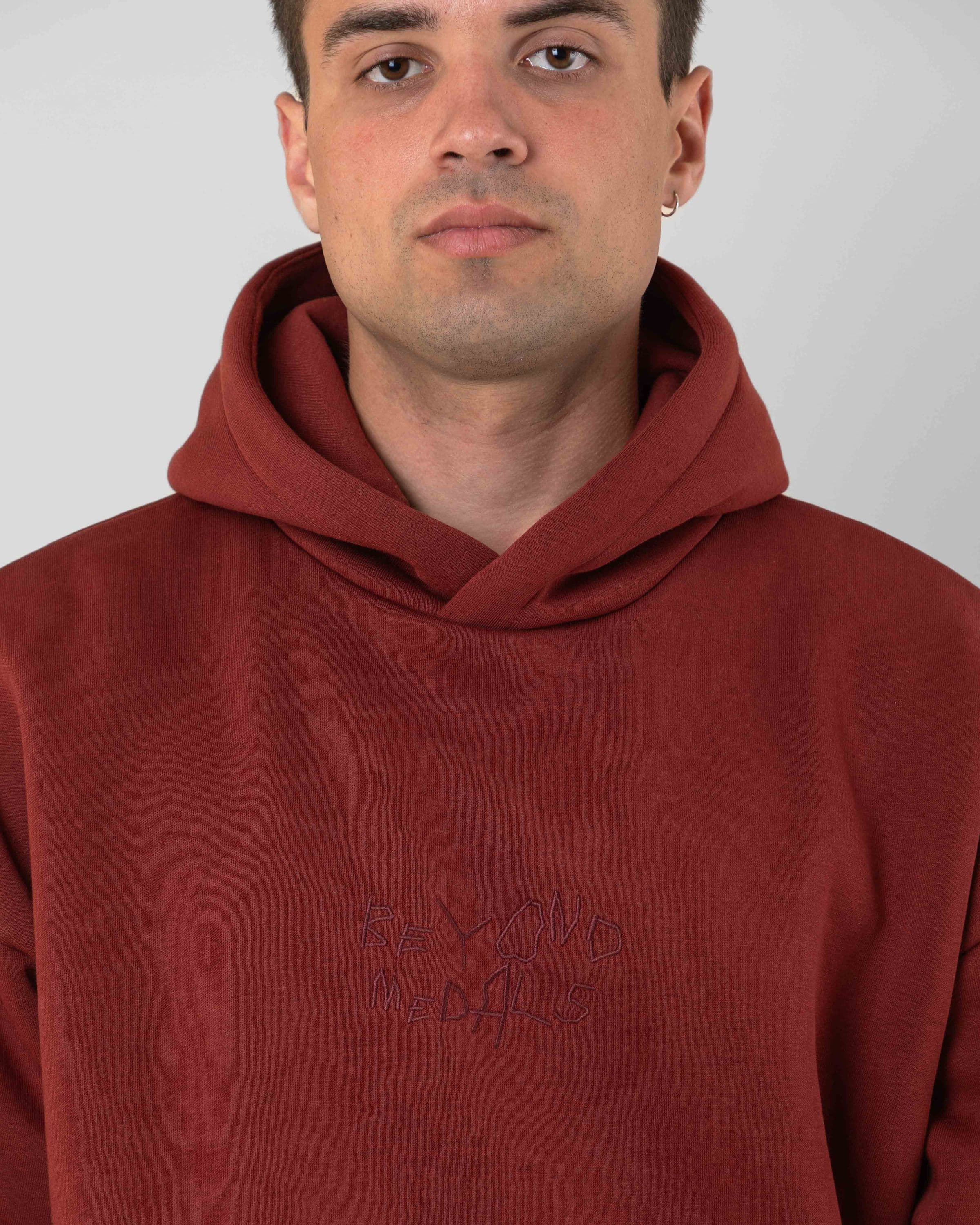 Streetwear clothing, angel hoodie 2.0 in red worn by model, Beyond Medals, 2024, detail1