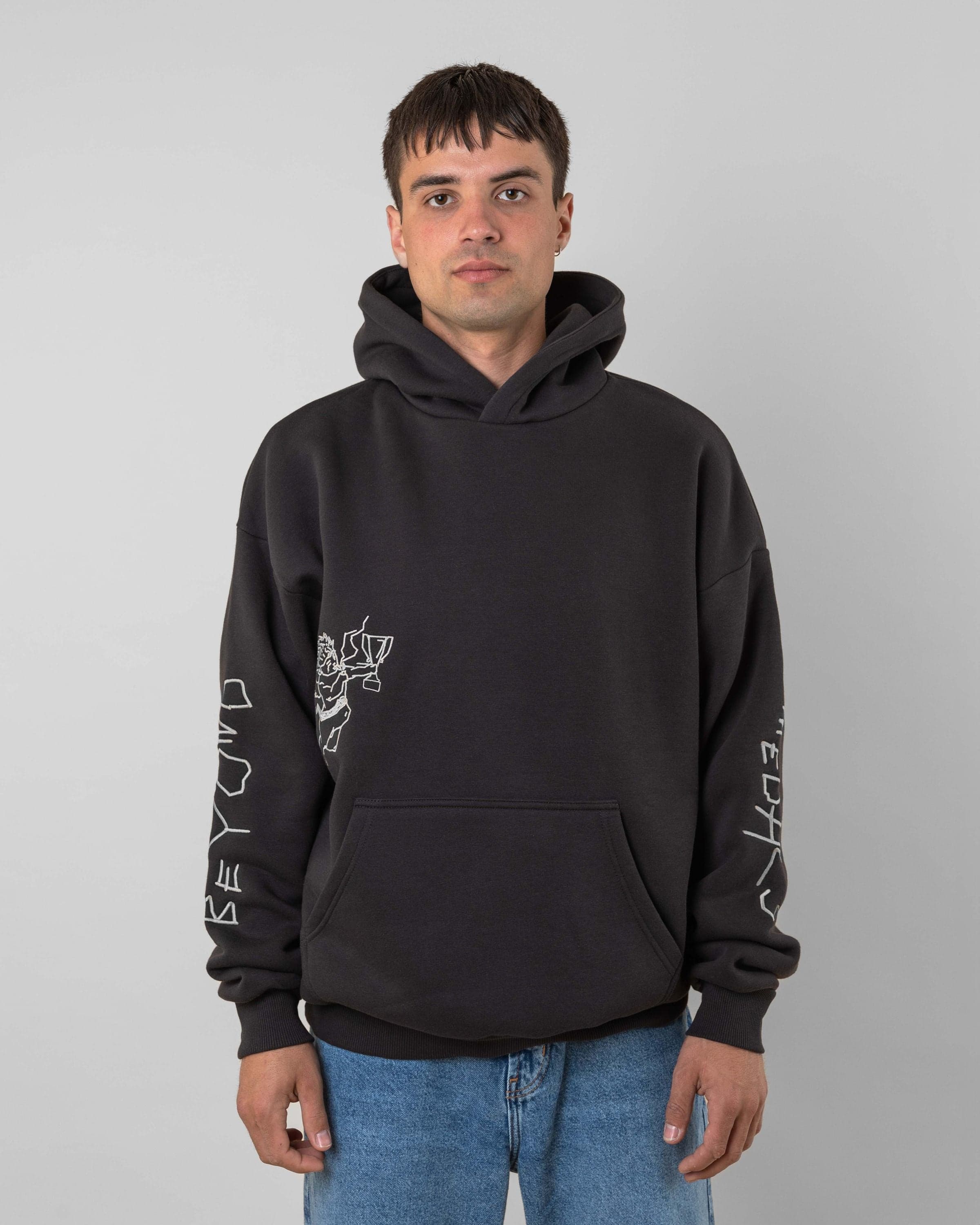 Streetwear clothing, angel hoodie 2.0 in grey worn by model, Beyond Medals, 2024, front1