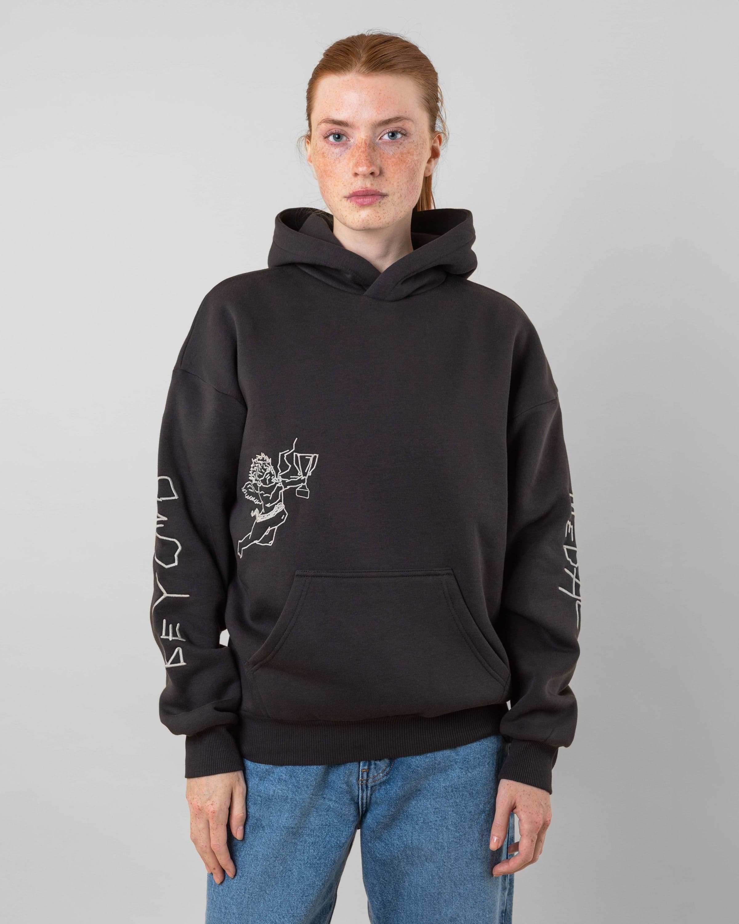 Streetwear clothing, angel hoodie 2.0 in grey worn by model, Beyond Medals, 2024, front
