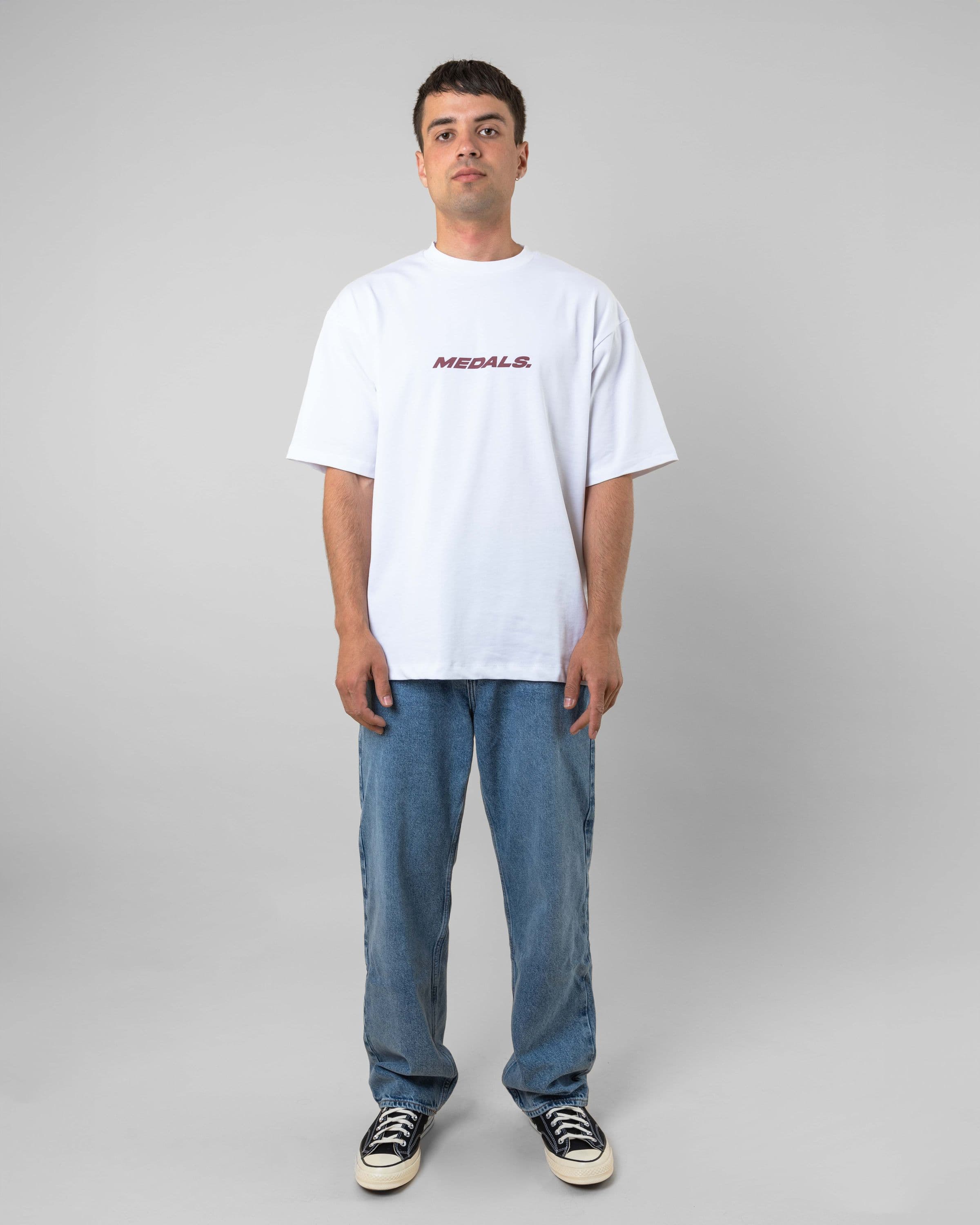 Streetwear clothing, medals tee in white worn by model, Beyond Medals, 2024, full front1