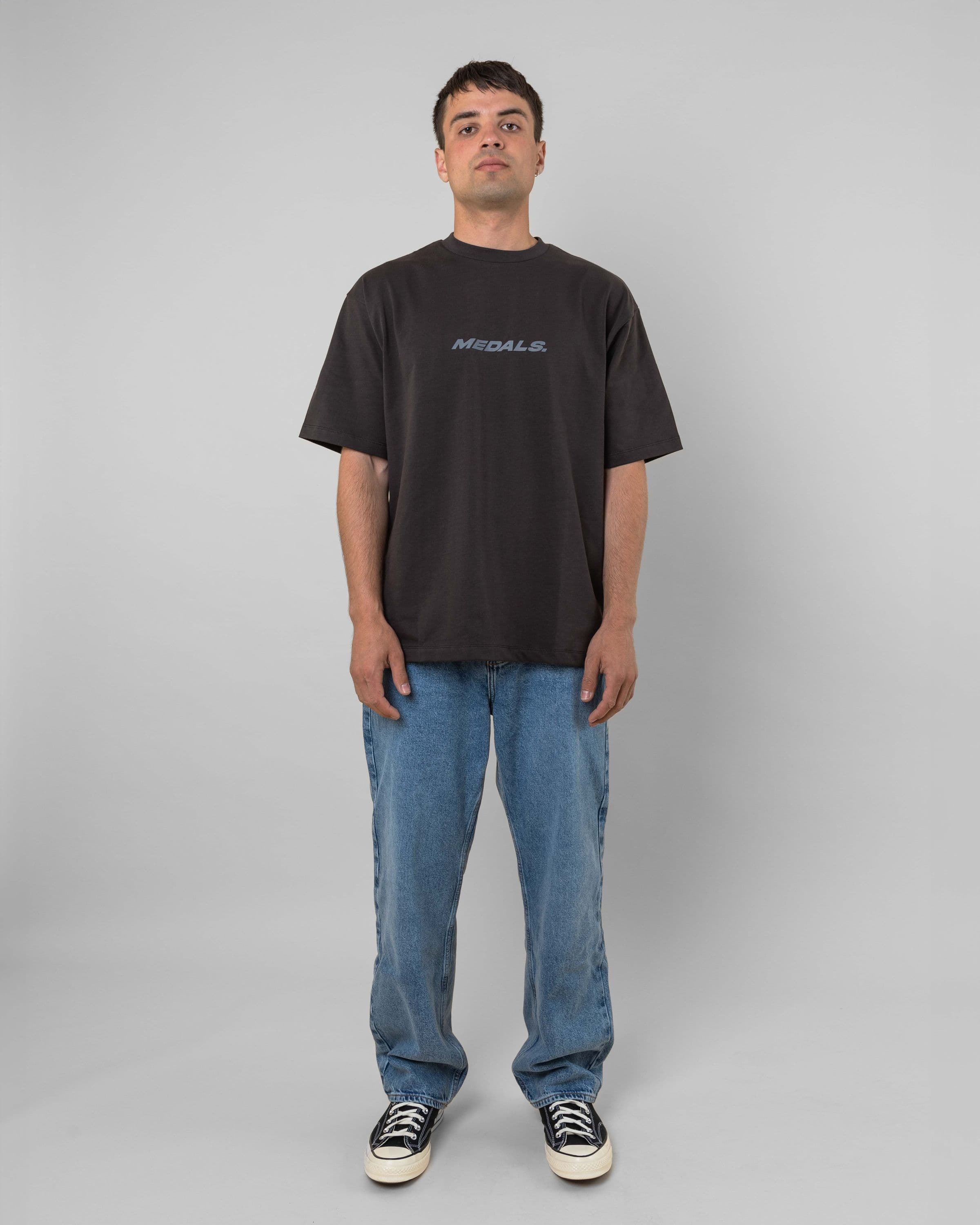 Streetwear clothing, medals tee in black worn by model, Beyond Medals, 2024, full front1