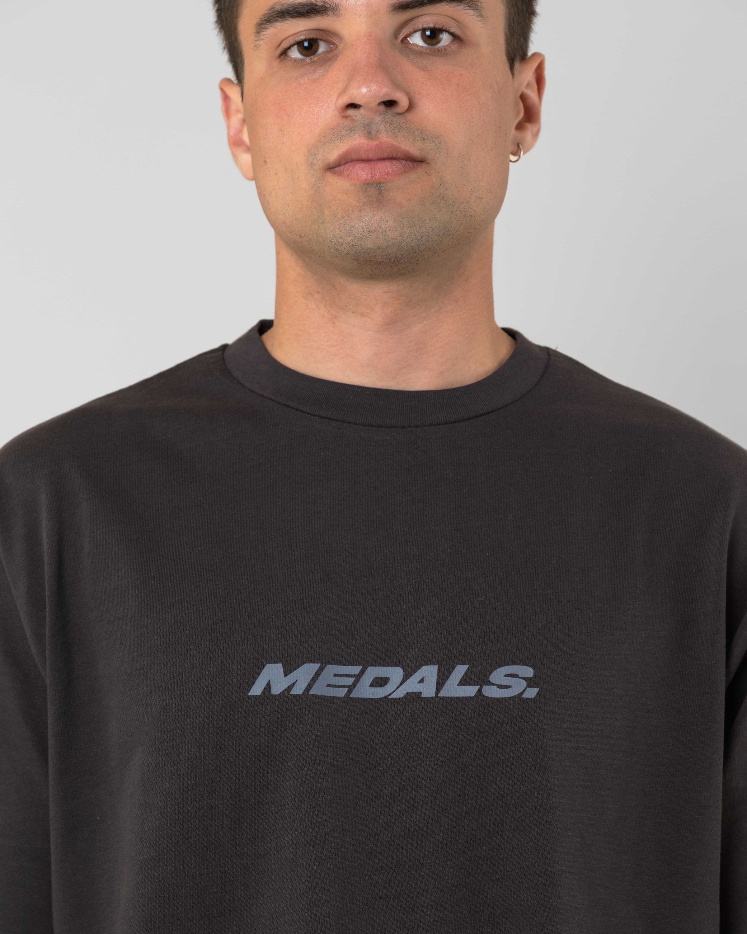 Streetwear clothing, medals tee in black worn by model, Beyond Medals, 2024, detail1