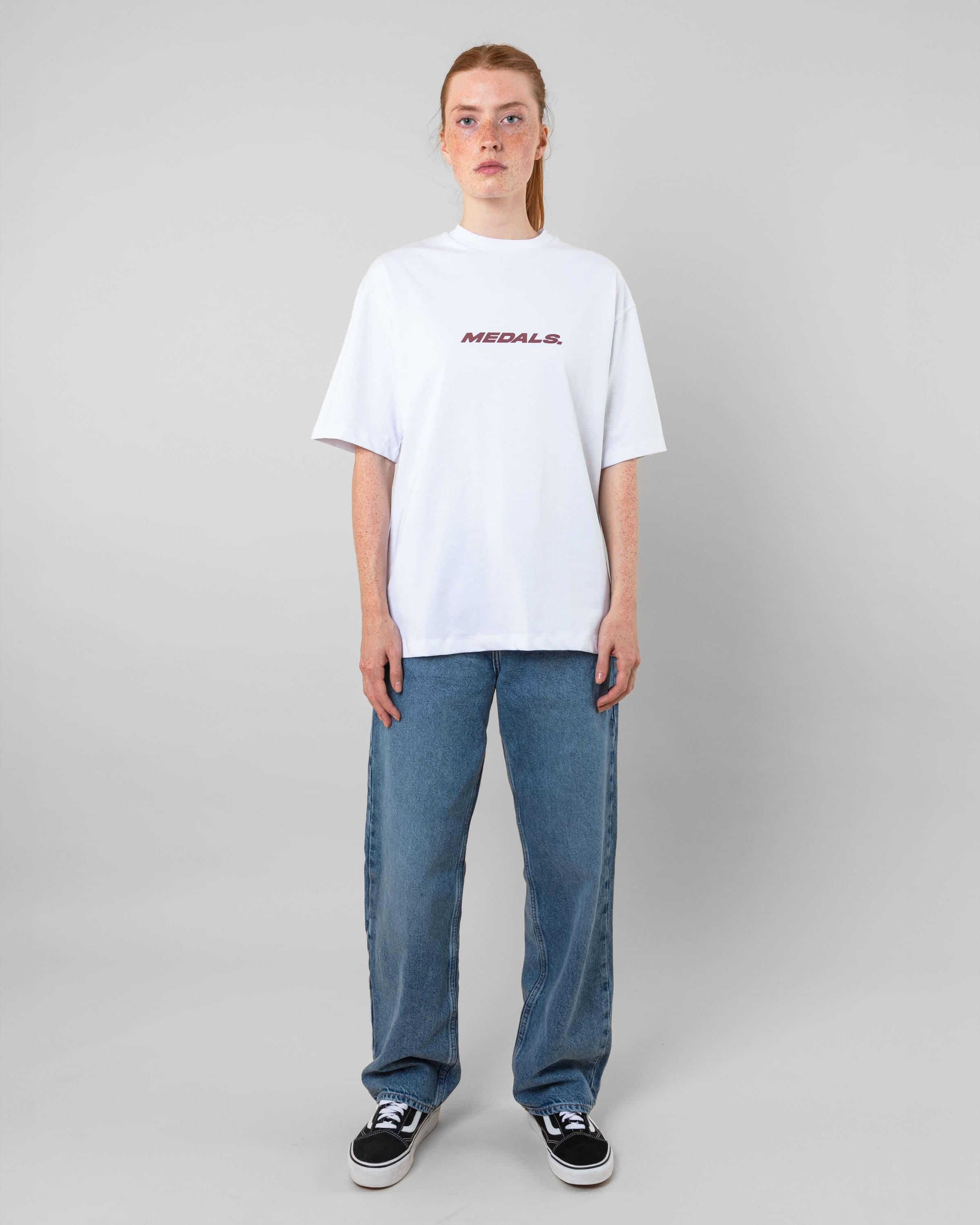 Streetwear clothing, medals tee in white worn by model, Beyond Medals, 2024, full front