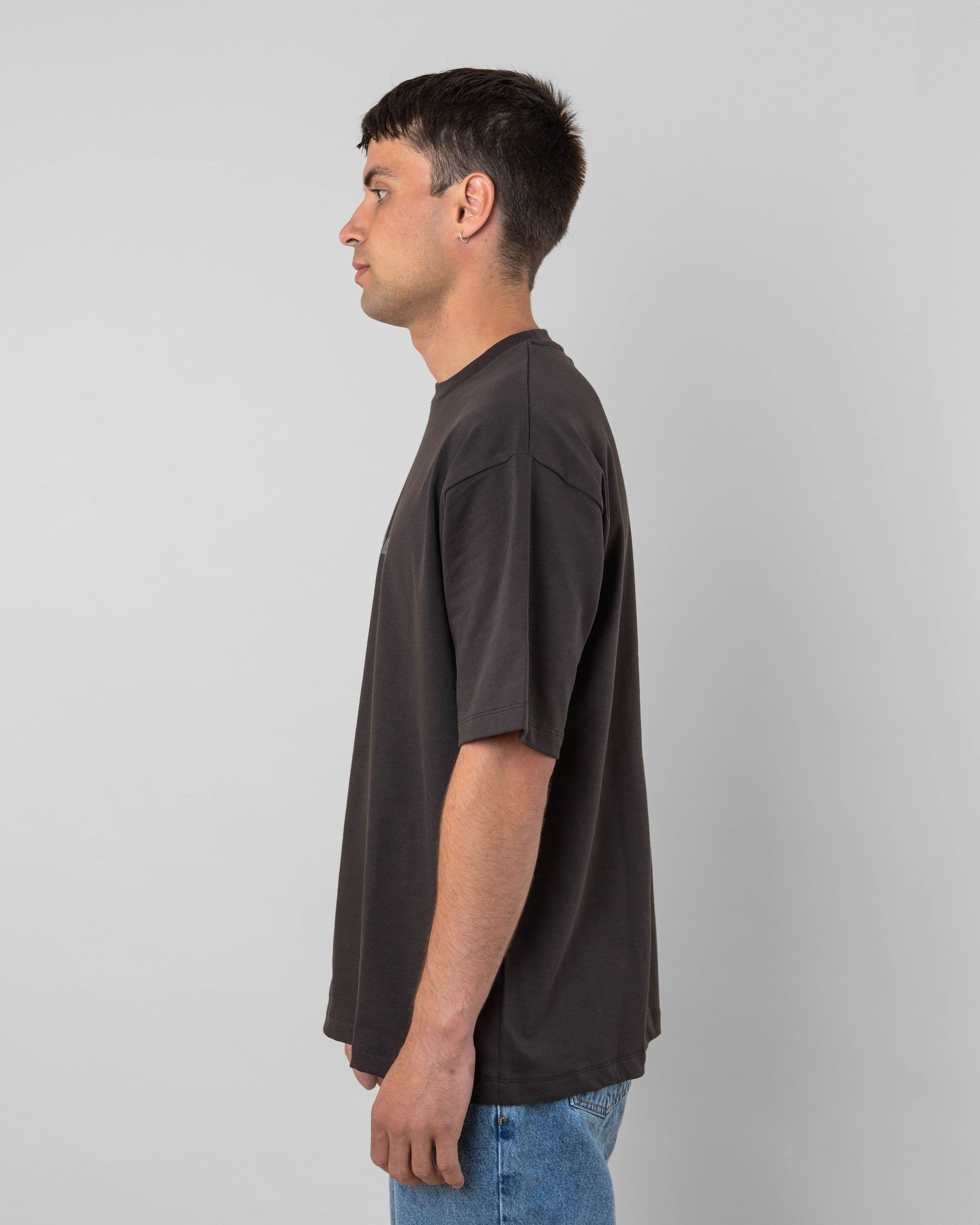 Streetwear clothing, medals tee in black worn by model, Beyond Medals, 2024, side1