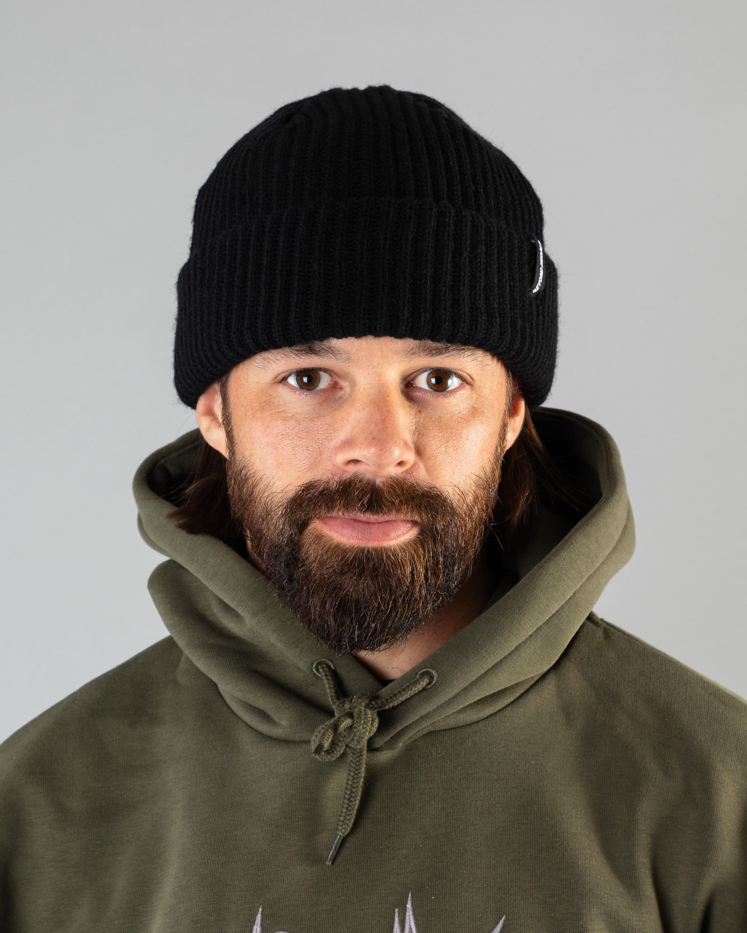 Outerwear accesories, shor beanie in black worn by ULRIK BADERTSCHER, Beyond Medals, 2024, front