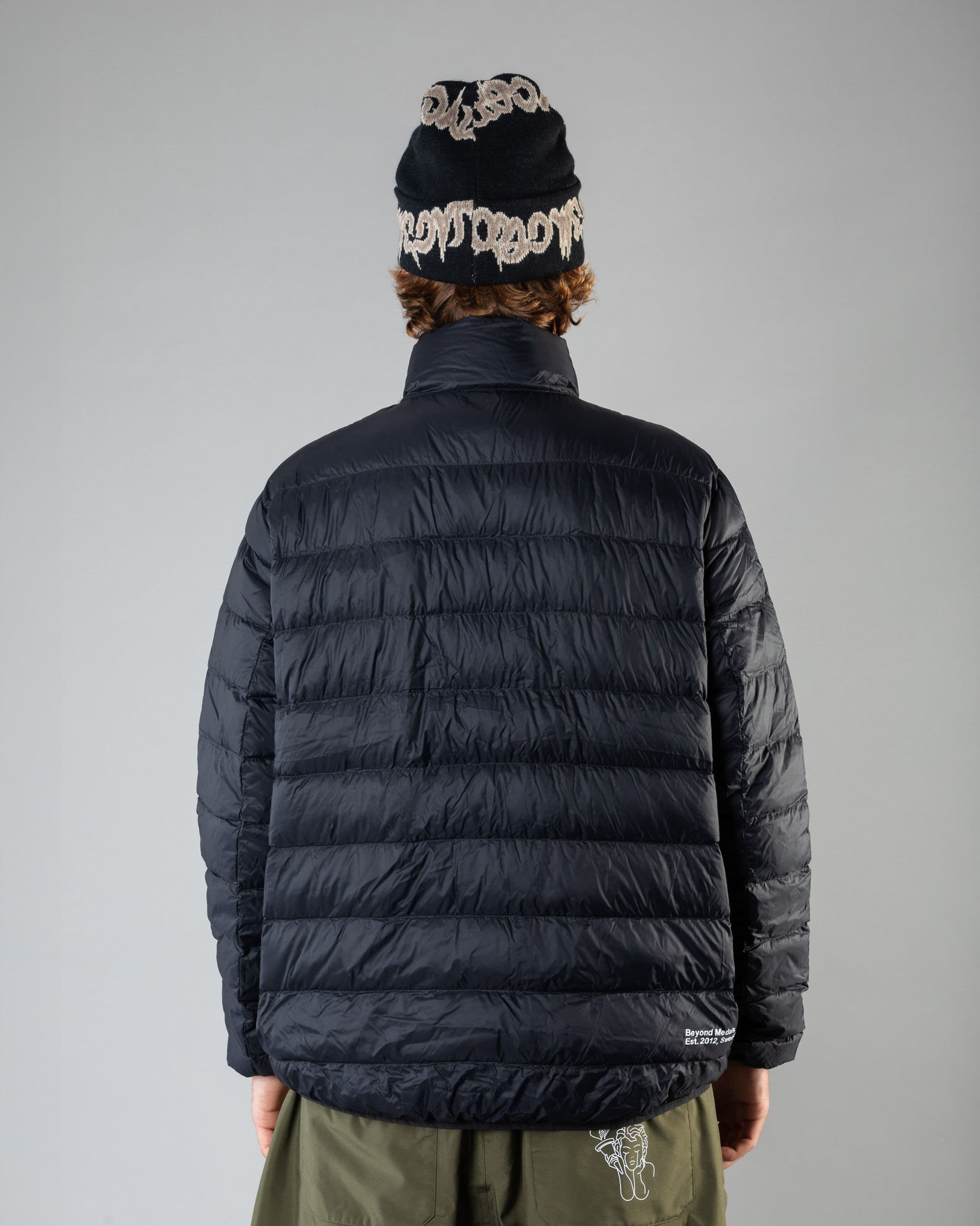 Outwear clothing, Packable Down Jacket in black worn by SEBBE DE BUCK, Beyond Medals, 2024, back