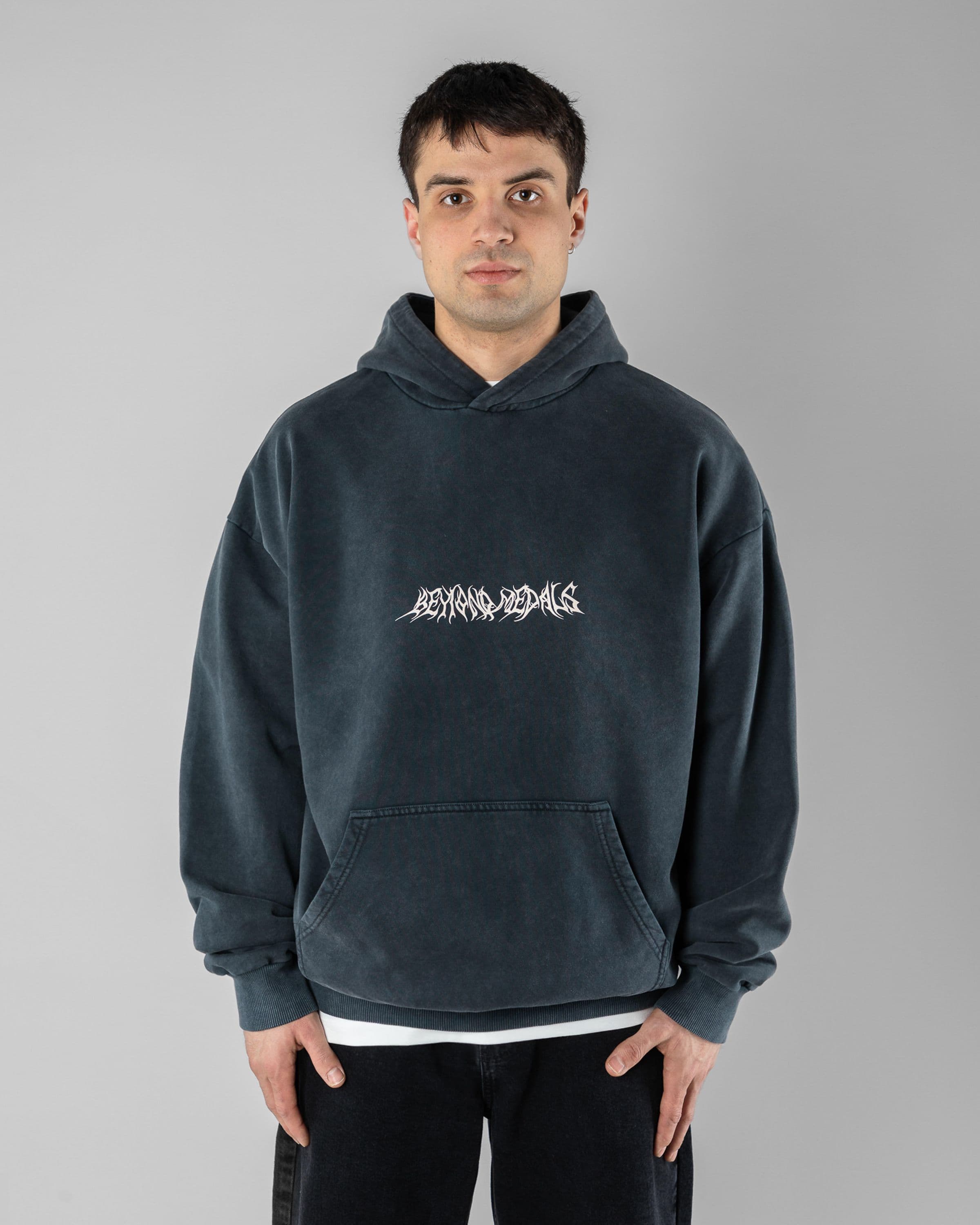 Acid Sin Hoodie Beyond Medals Snowboard & Streetwear Model image front with Magnus as model