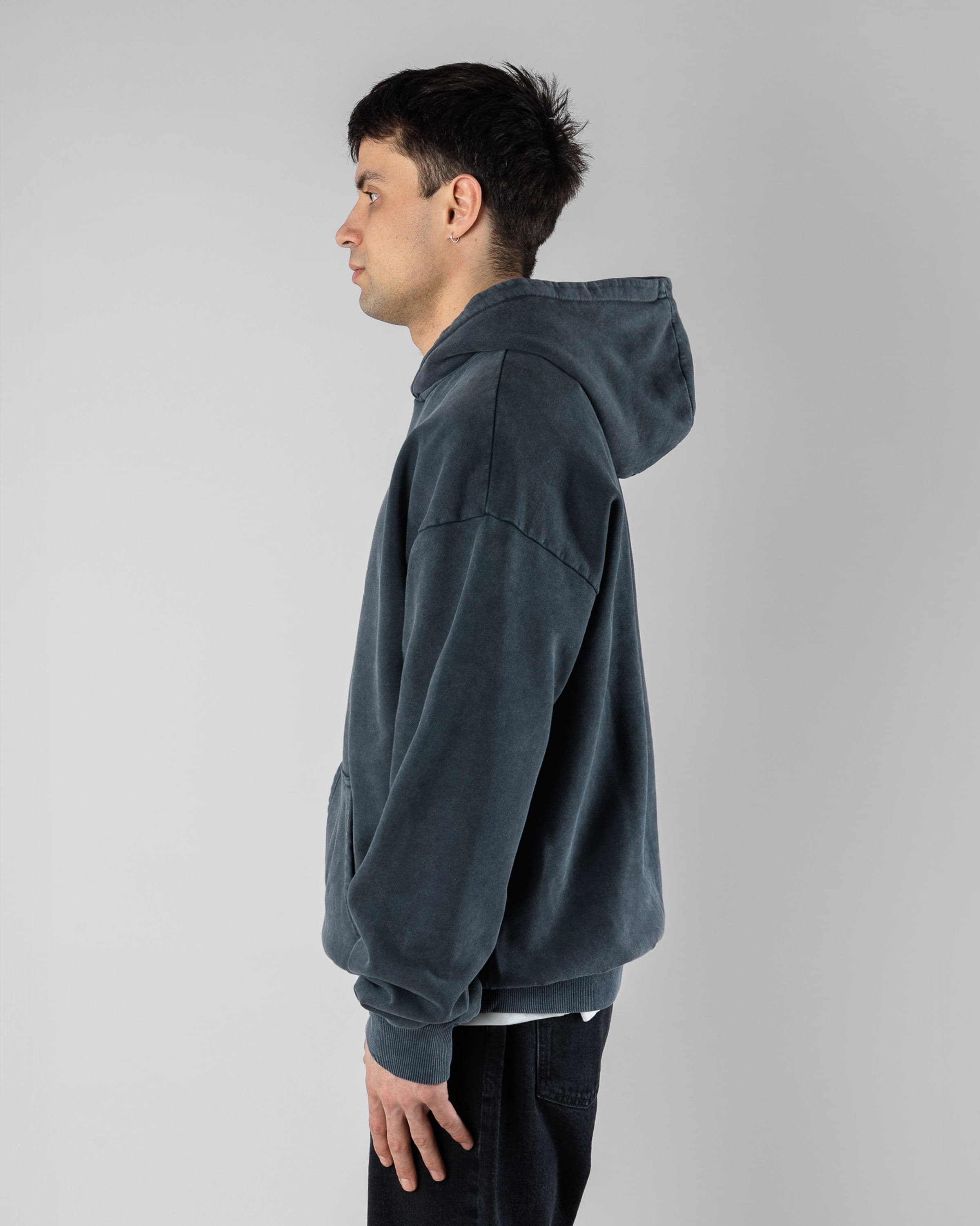 Acid Sin Hoodie Beyond Medals Snowboard & Streetwear Model image side with Magnus as model