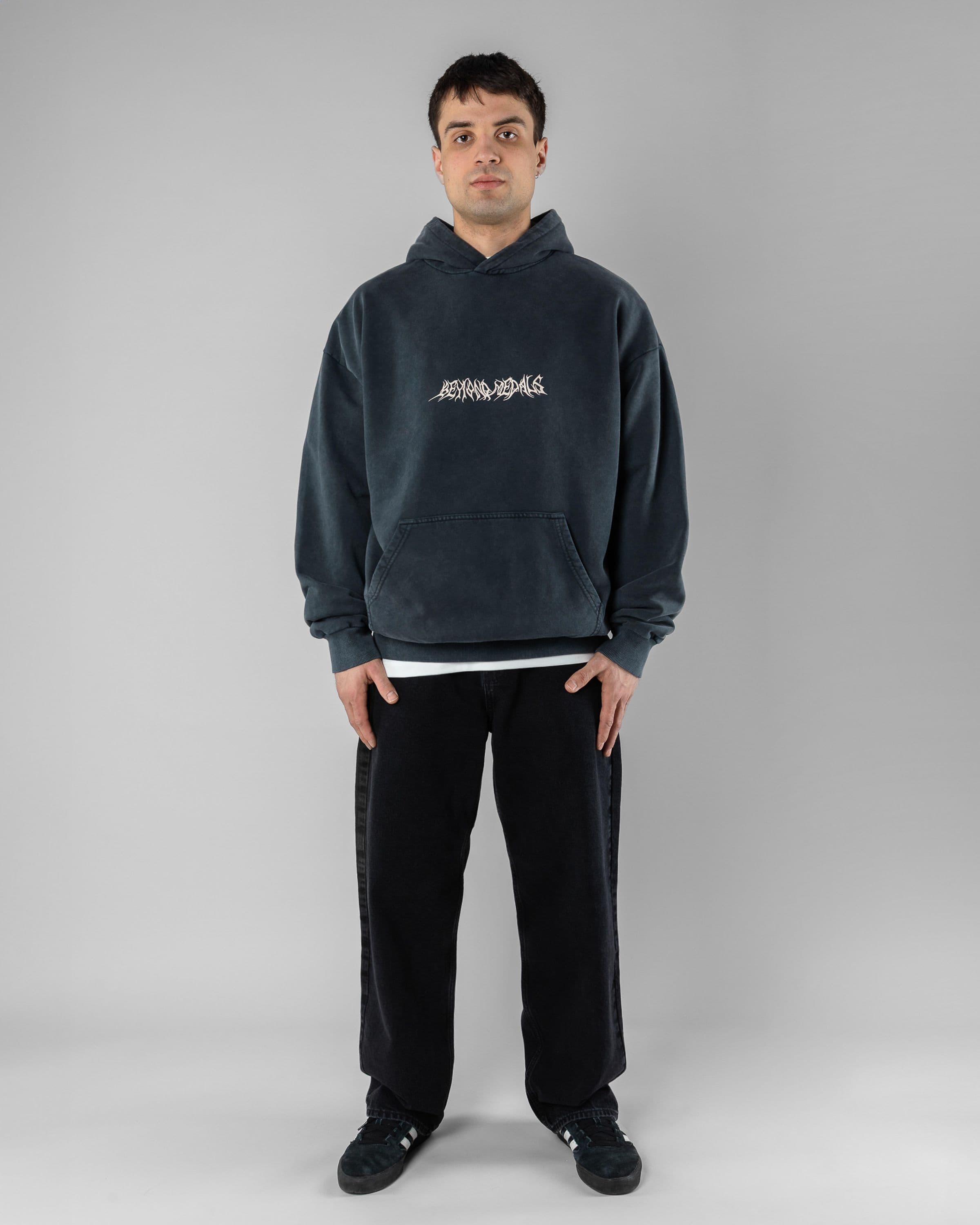 Acid Sin Hoodie Beyond Medals Snowboard & Streetwear Model image front with Magnus as model