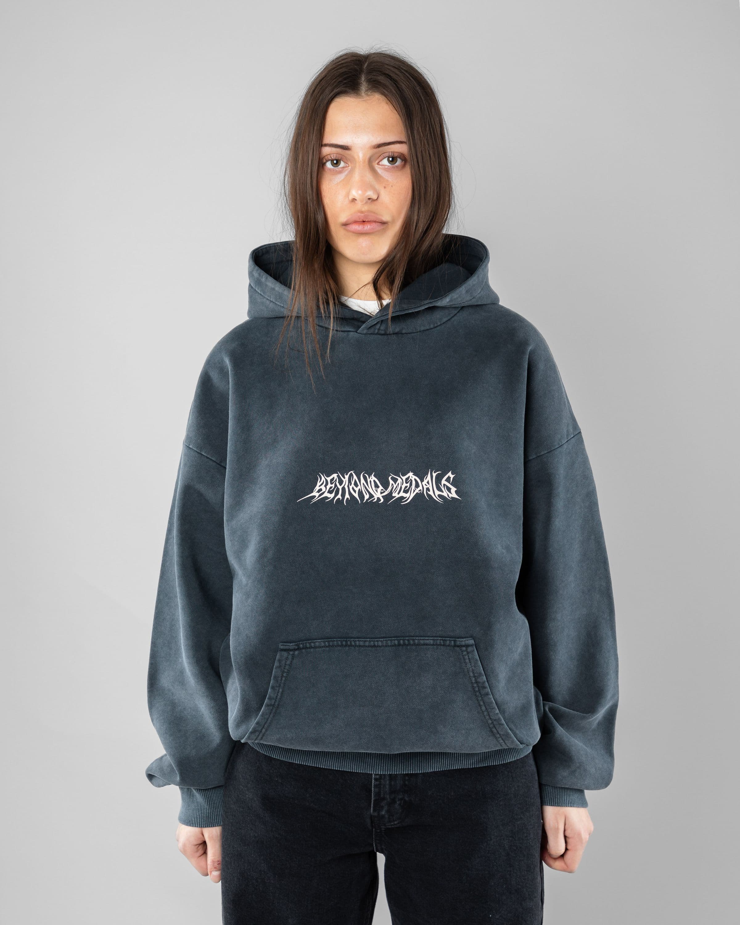 Acid Sin Hoodie Beyond Medals Snowboard & Streetwear Model image front with Saga as model