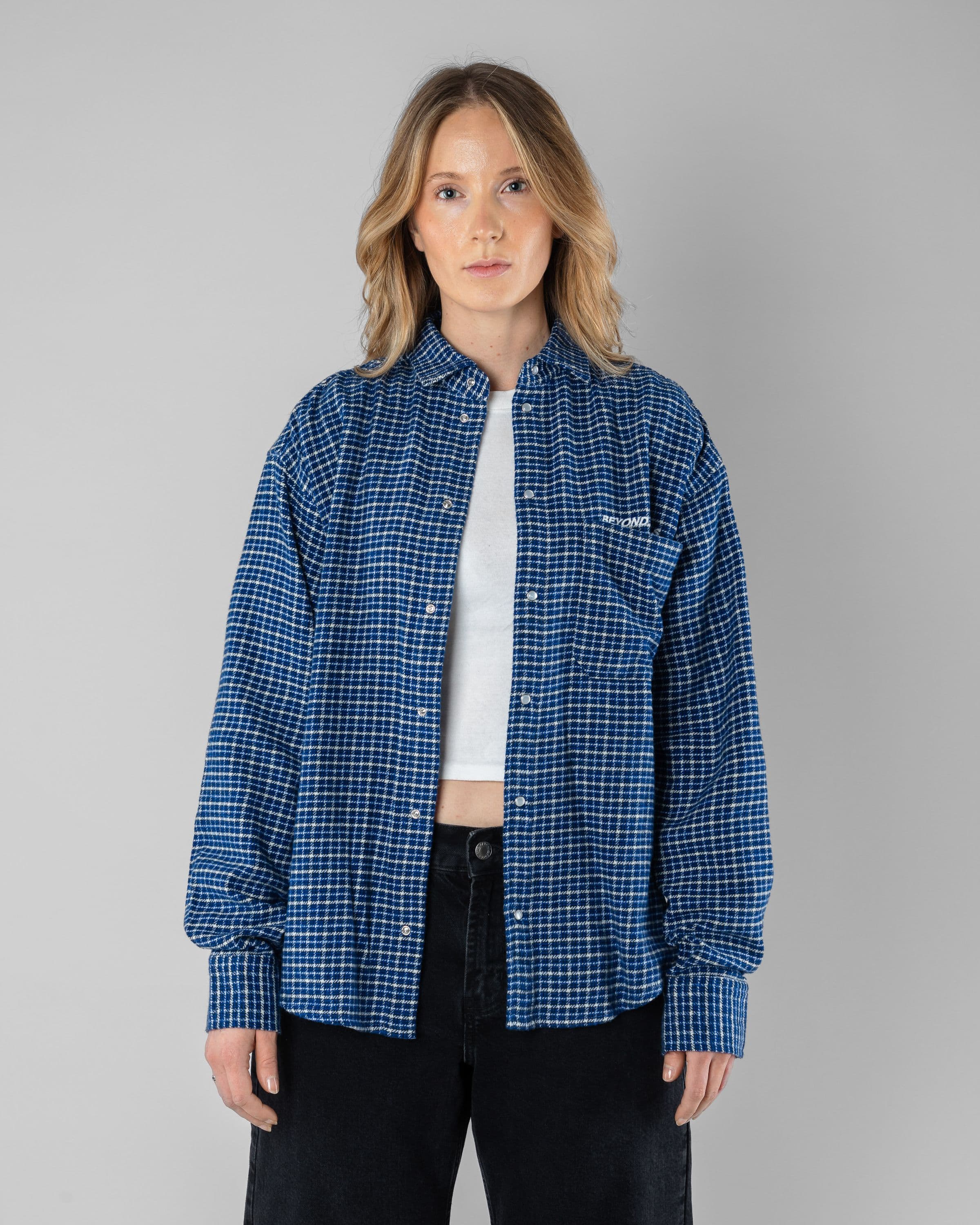 Checkered Shirt Beyond Medals Snowboard & Streetwear Model image front with Astrid as model
