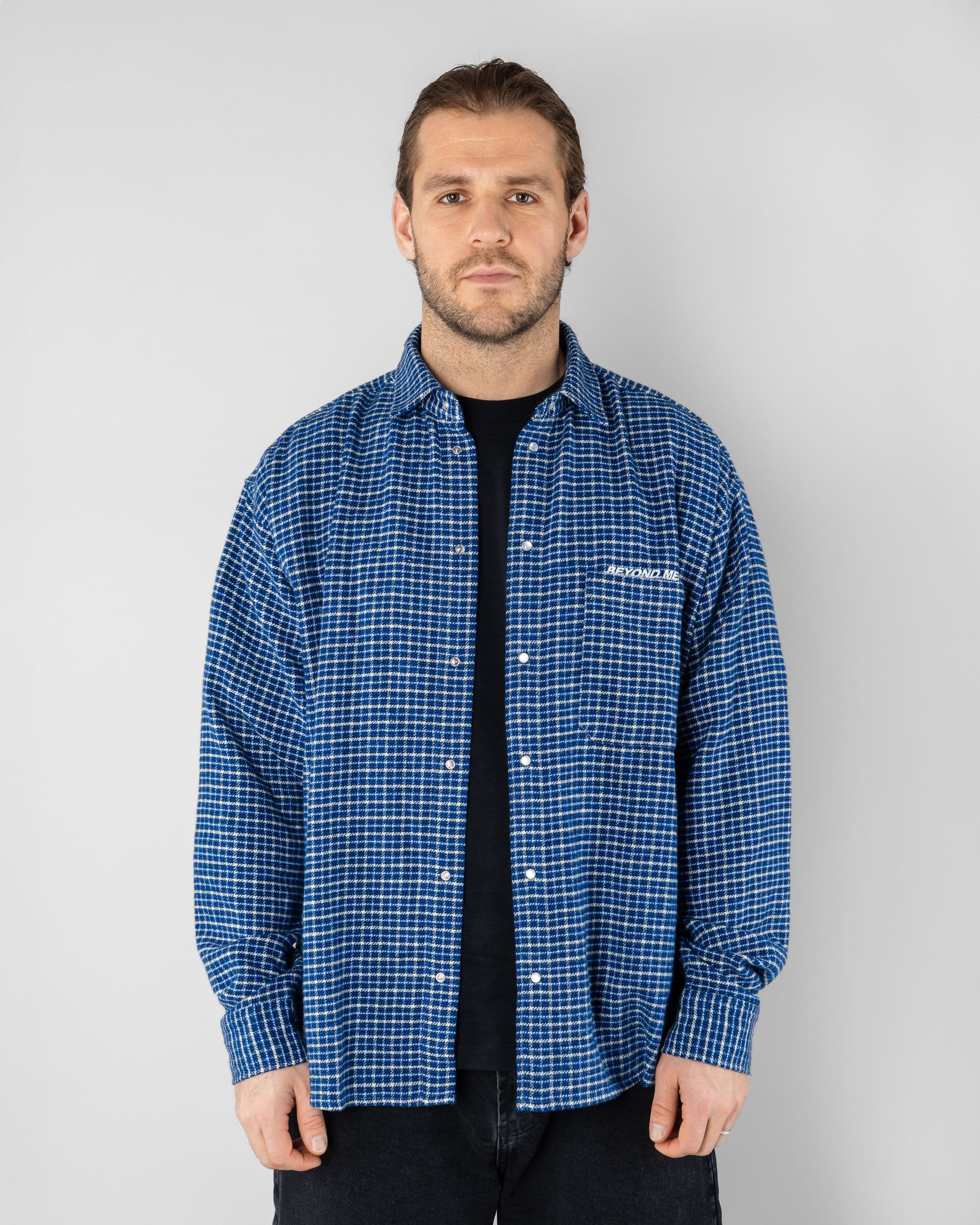Checkered Shirt Beyond Medals Snowboard & Streetwear Model image front with Tor as model