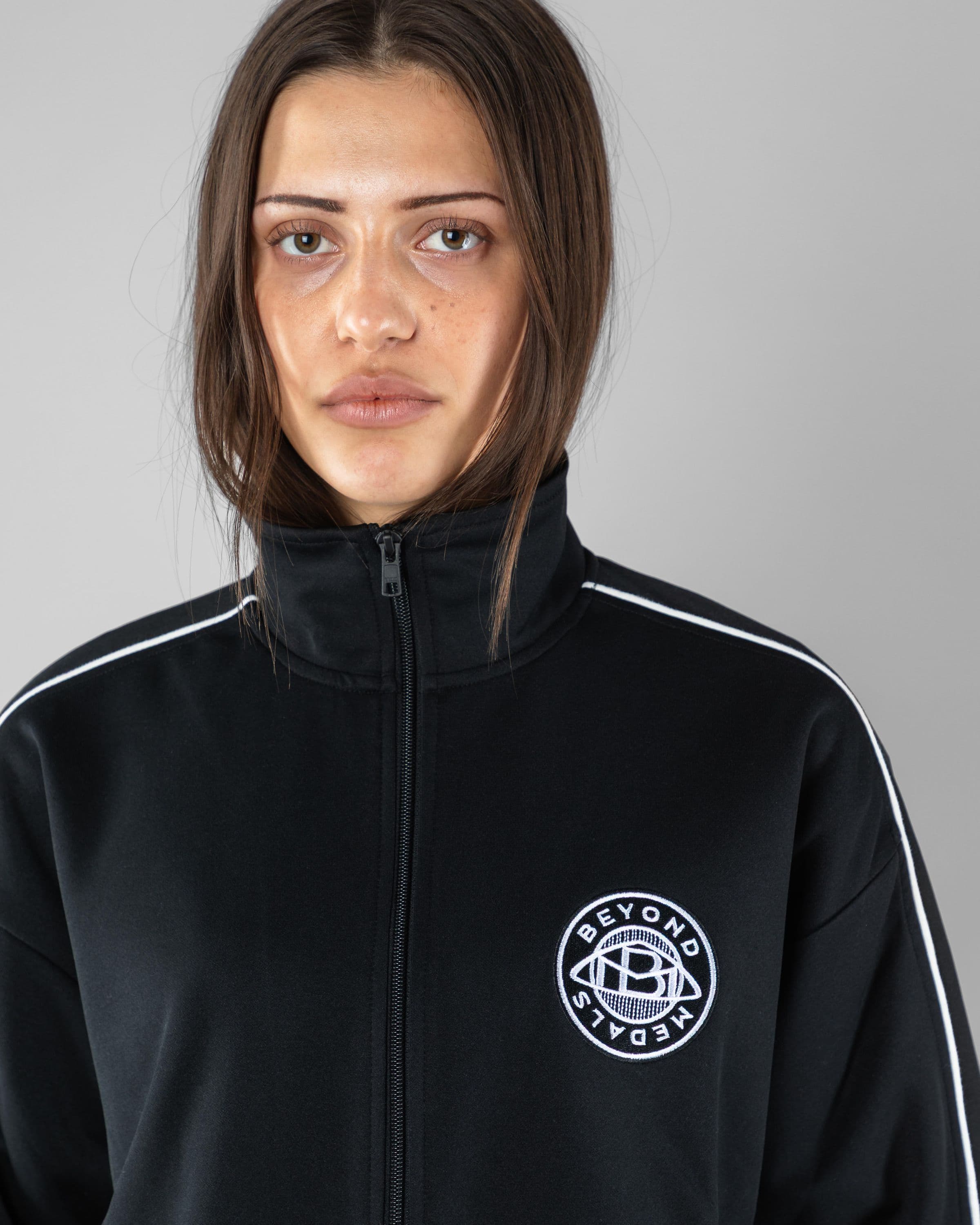 Track Jacket Beyond Medals Snowboard & Streetwear Model image close up with Saga as model