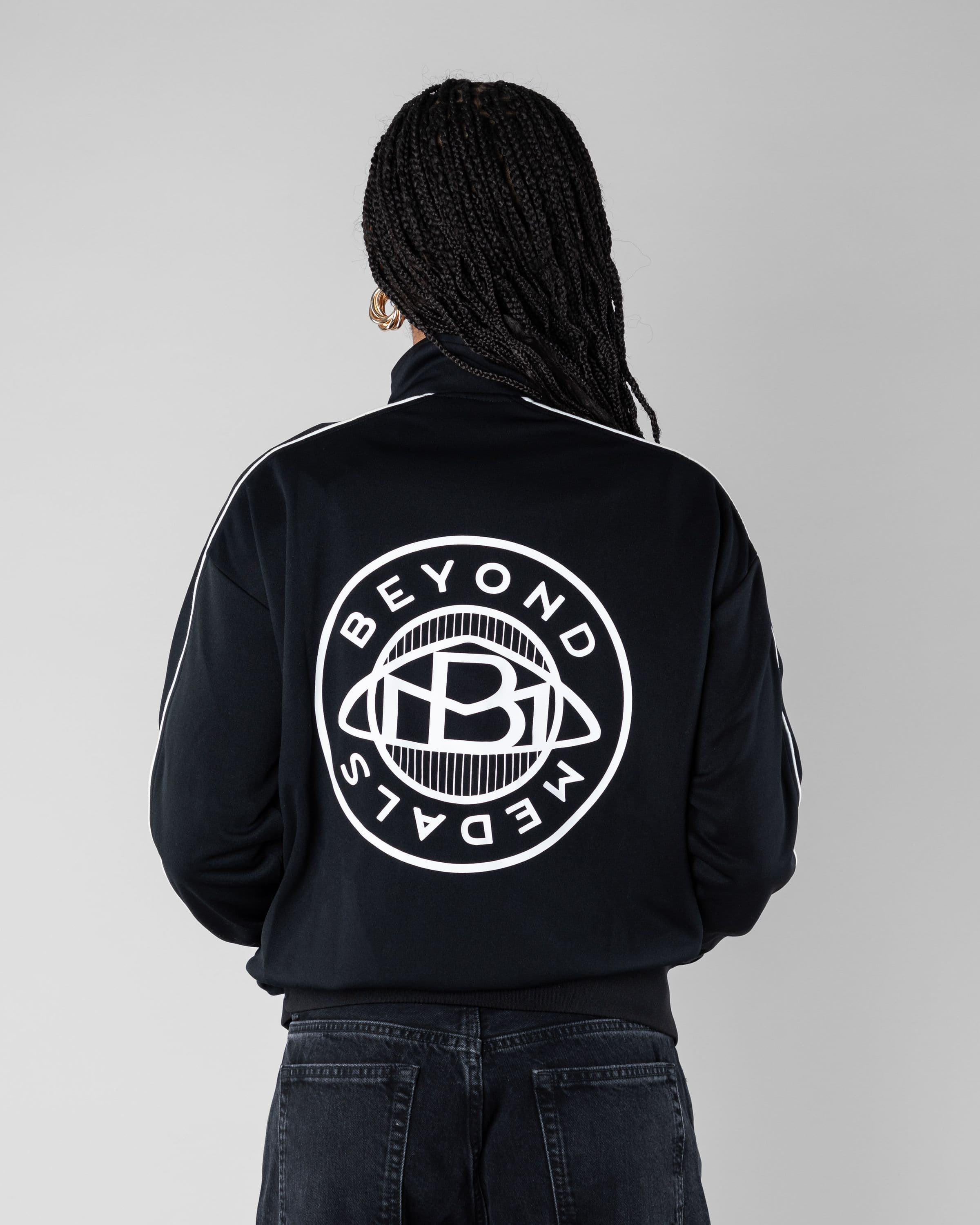 Track Jacket Beyond Medals Snowboard & Streetwear Model image back with Mimi as model