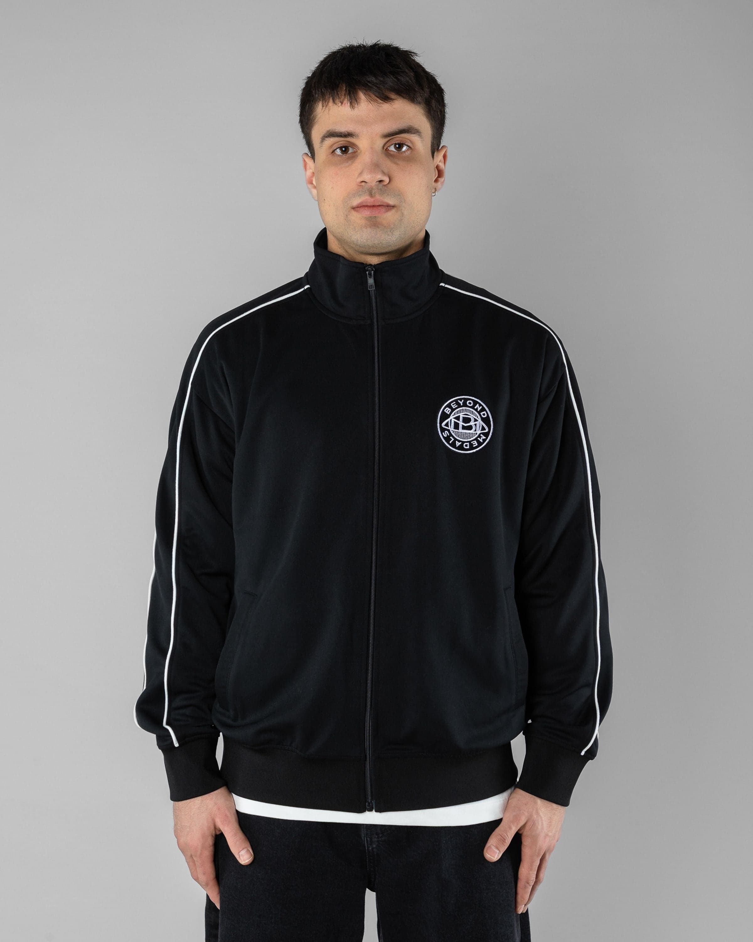 Track Jacket Beyond Medals Snowboard & Streetwear Model image front with Magnus as model