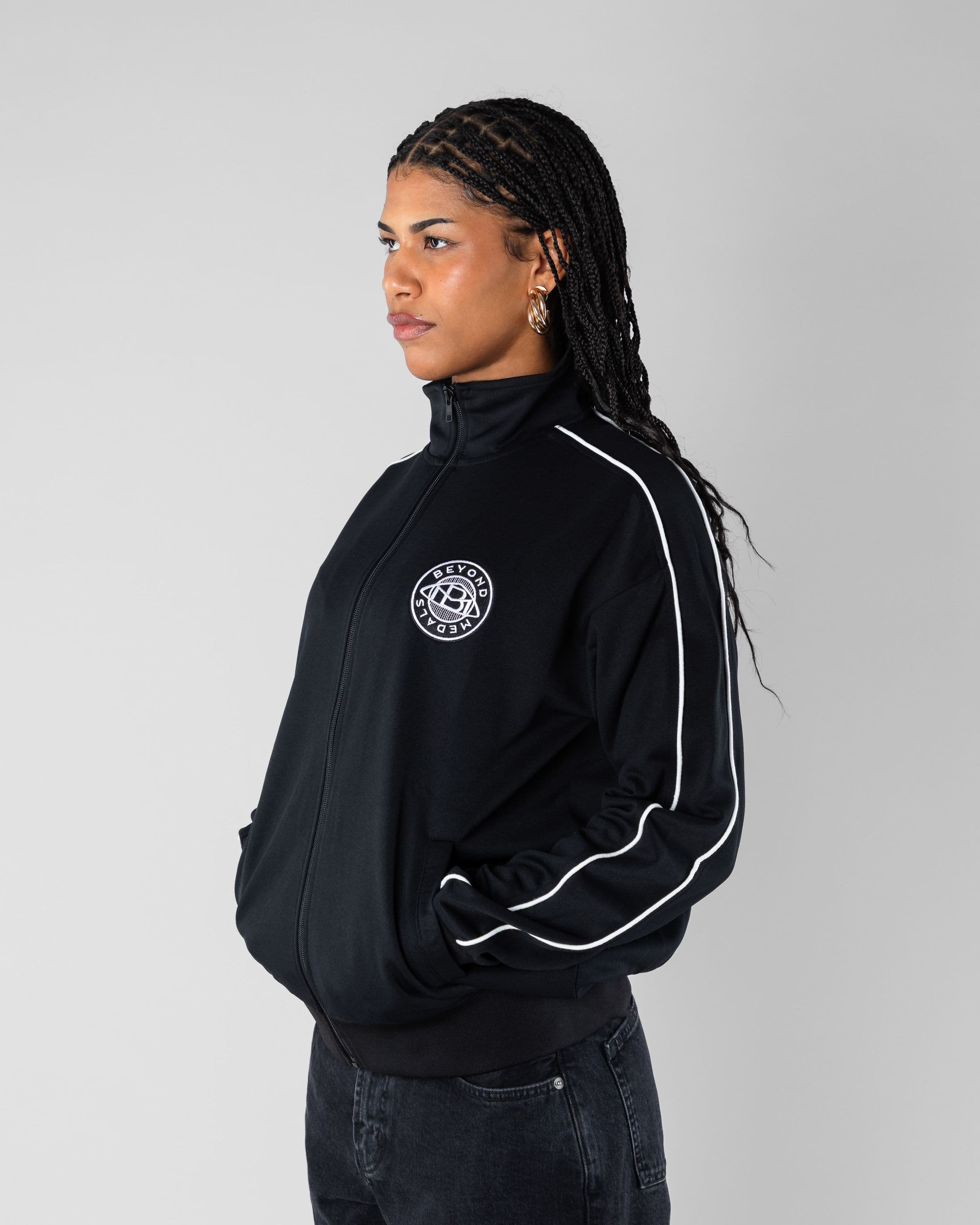 Track Jacket Beyond Medals Snowboard & Streetwear Model image side with Mimi as model