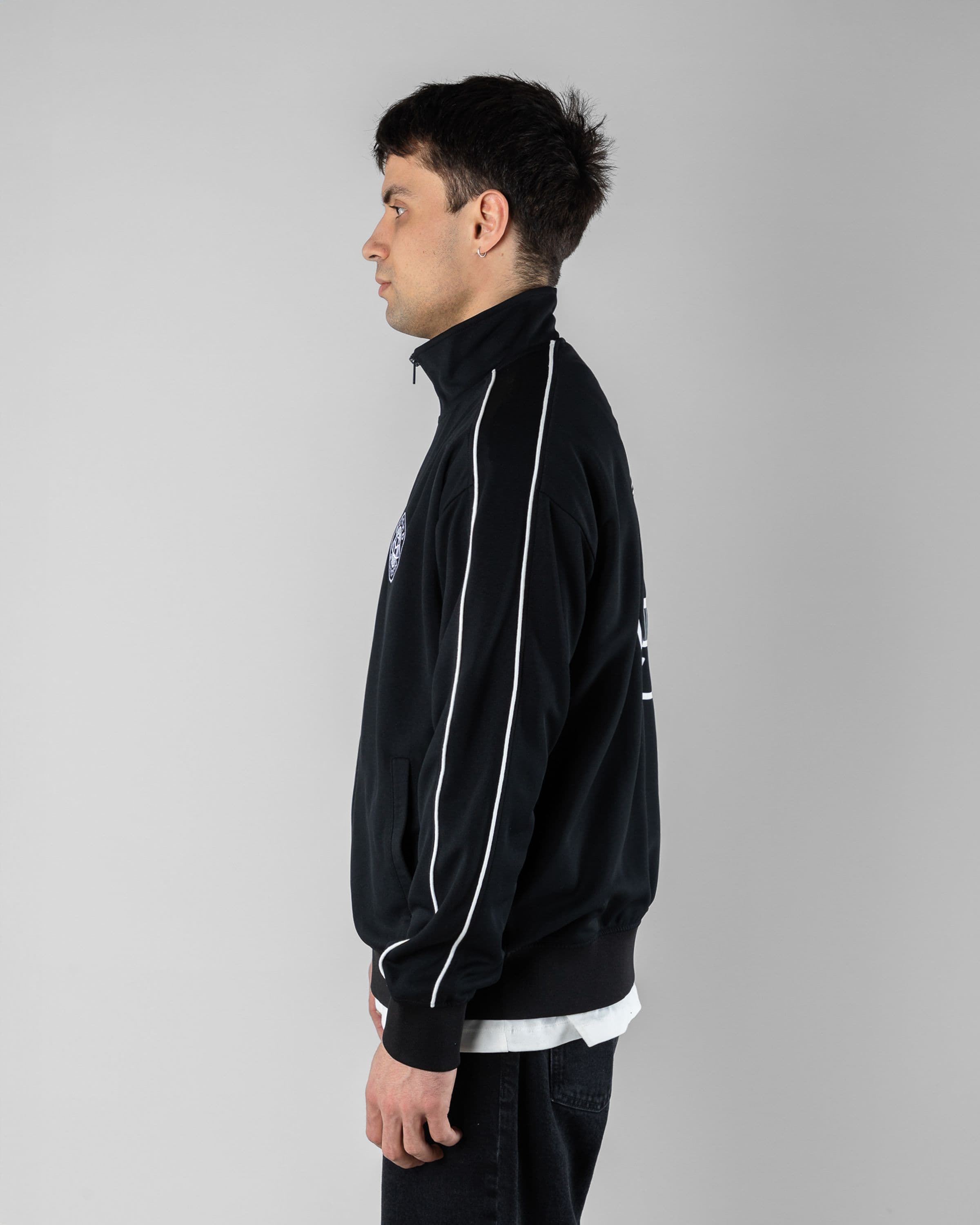 Track Jacket Beyond Medals Snowboard & Streetwear Model image side with Magnus as model