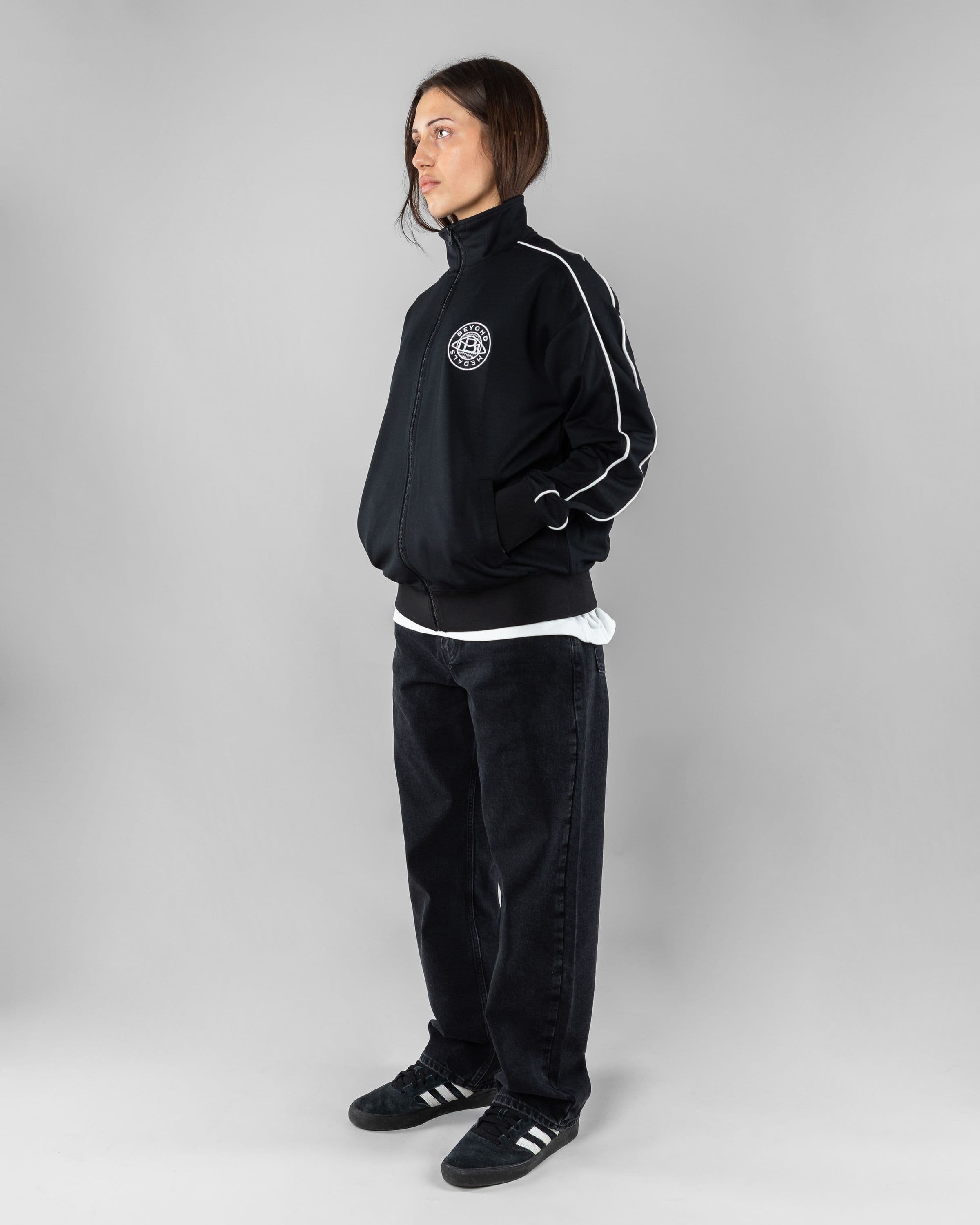 Track Jacket Beyond Medals Snowboard & Streetwear Model image side with Saga as model