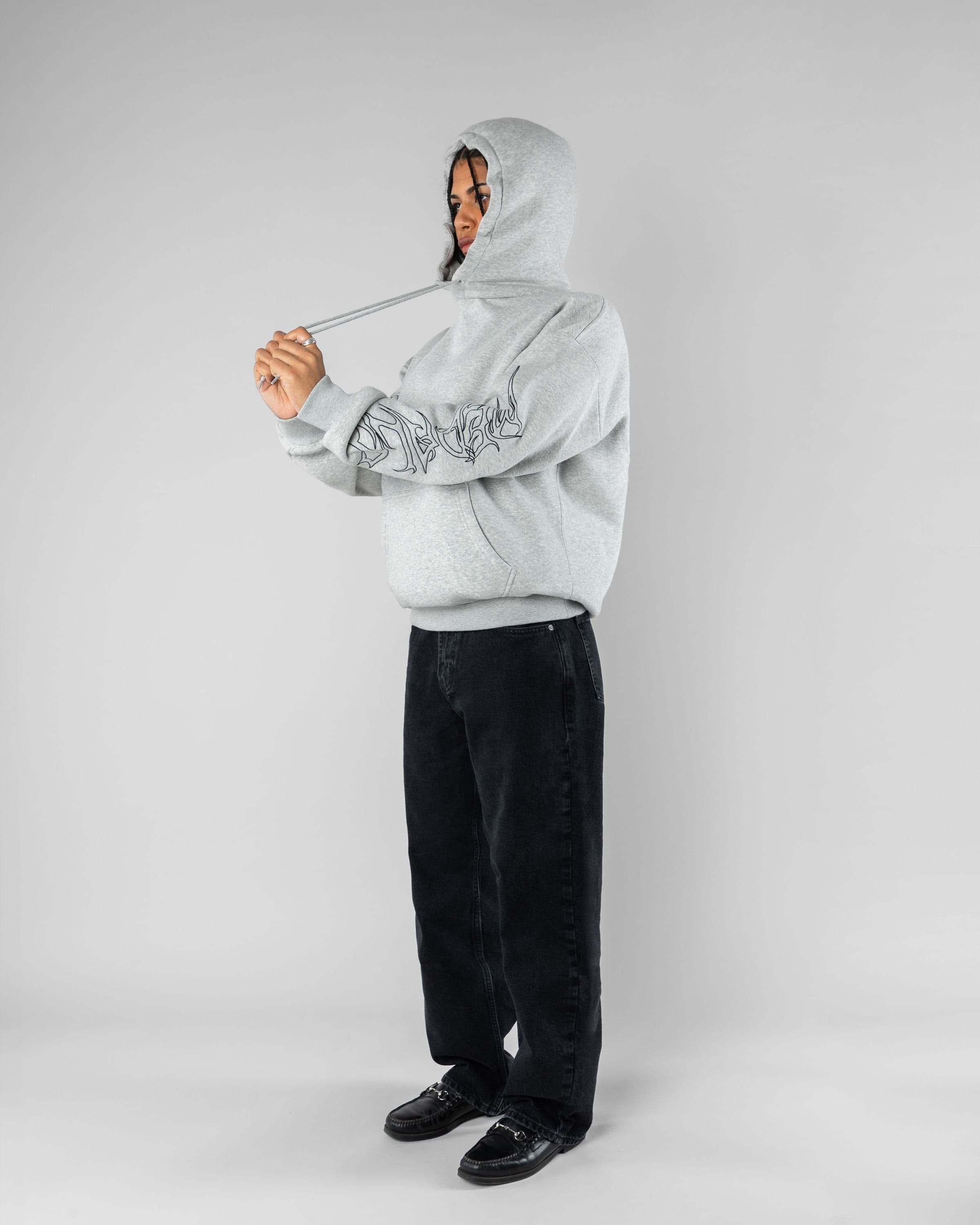 Sin Hoodie Beyond Medals Snowboard & Streetwear Model image side with Mimi as model