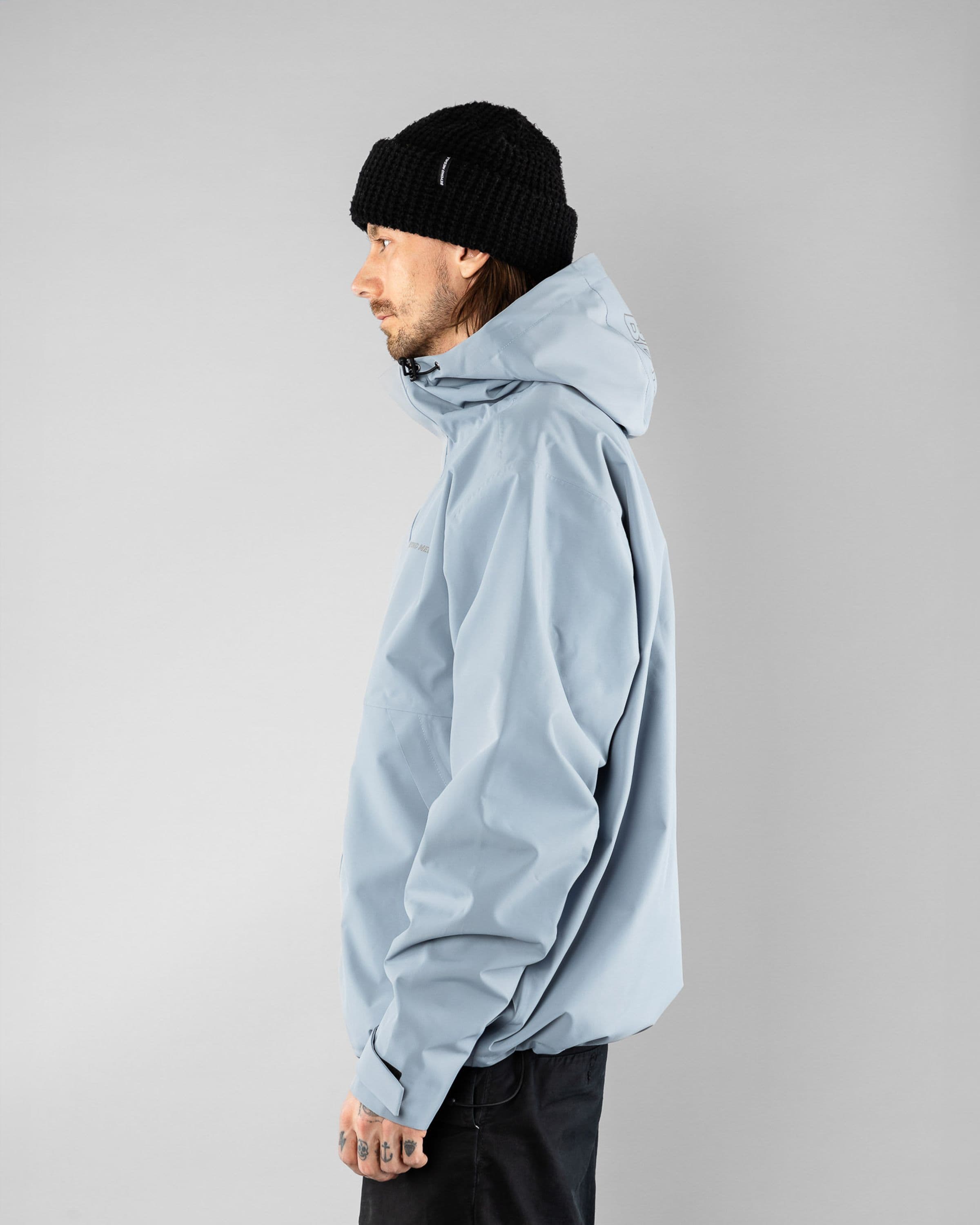 The Jacket Beyond Medals Snowboard & Streetwear Model image side with Kevin as model